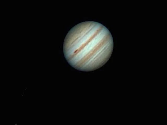 Jupiter observed through a refractor telescope