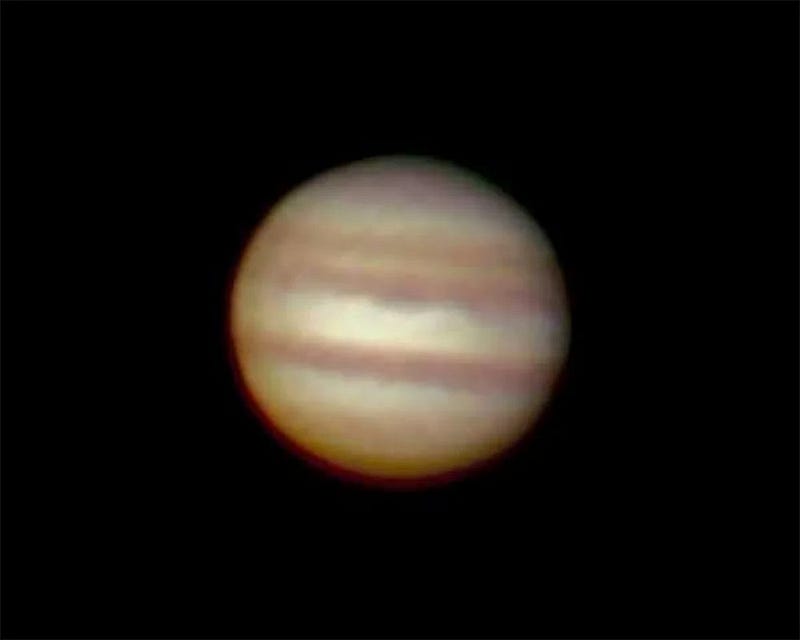 Jupiter viewed through a Newtonian reflector telescope