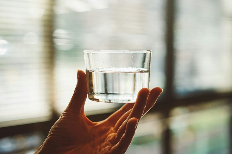 Glass of sugar water on a table