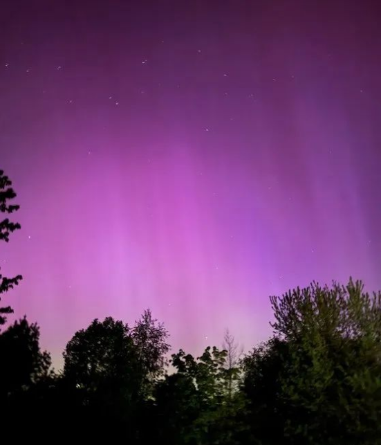 Pink auroras lighting up the night sky in New York